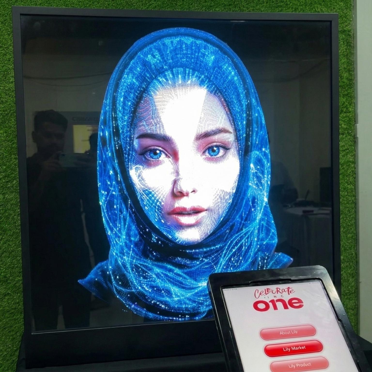 AI kiosk at an event features a digital display of a ai hologram woman in a blue hijab